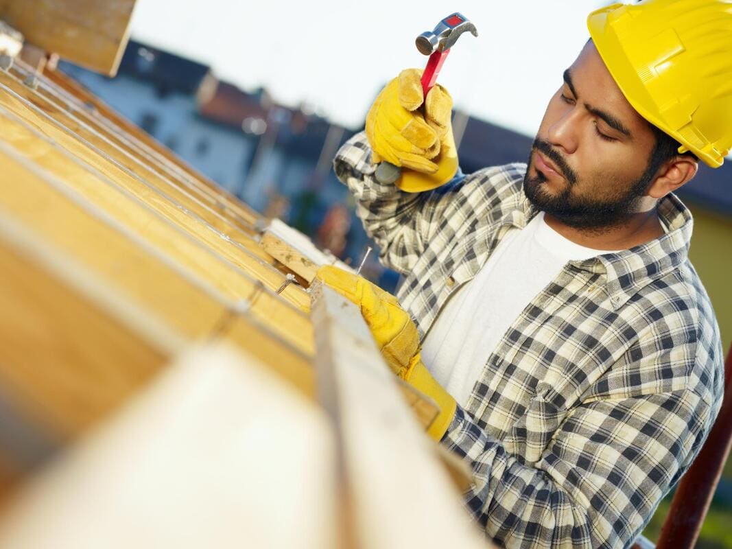 Roof edge repair work near fascia